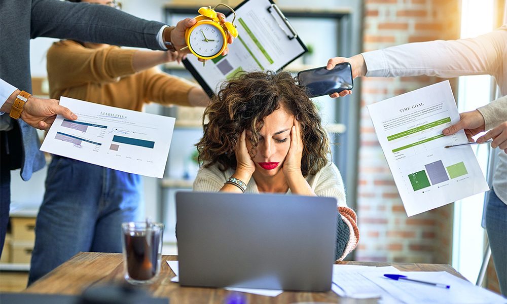 Group of business workers working together. Partners stressing one of them at the office