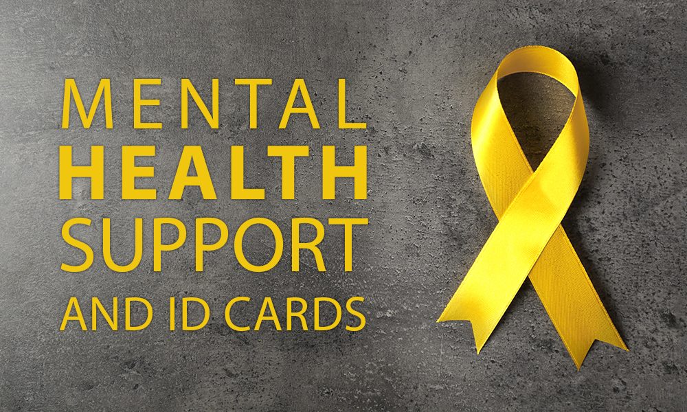 Yellow awareness ribbon on grey textured background